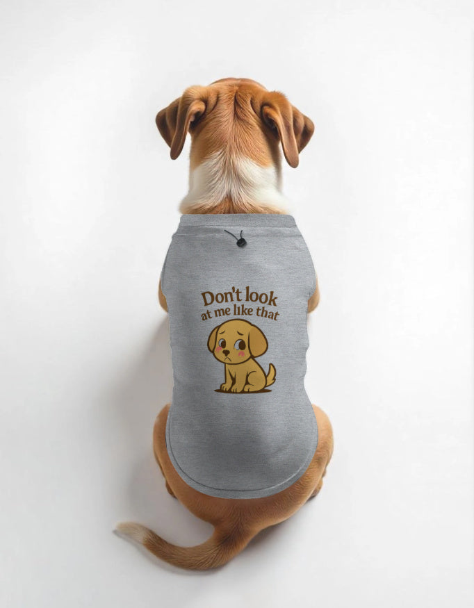 Dog wearing a gray t-shirt with a cartoon dog and text on a white background