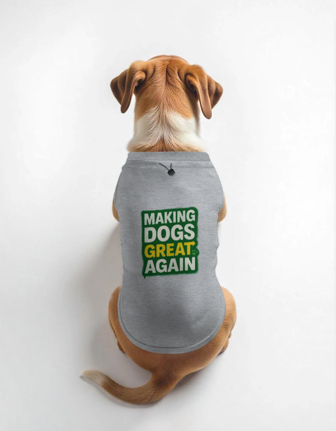 Dog wearing a gray shirt with 'Making Dogs Great Again' text on a white background