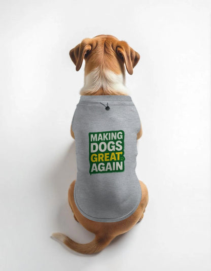 Dog wearing a gray shirt with 'Making Dogs Great Again' text on a white background